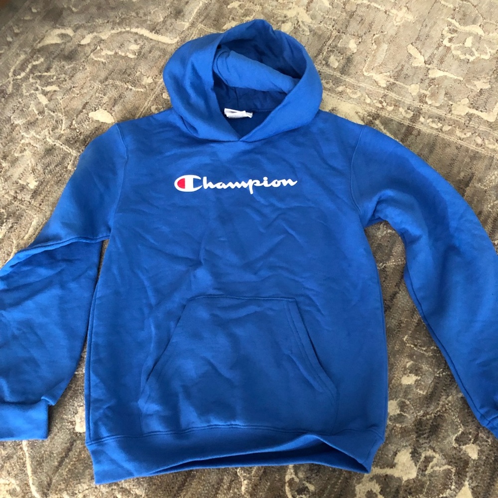 Brand New without tags. Champion blue sweatshirt. Size M